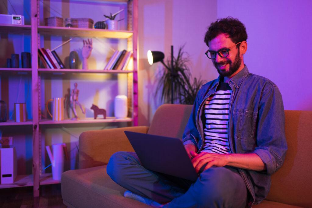 Portrait of a young man working from his living room