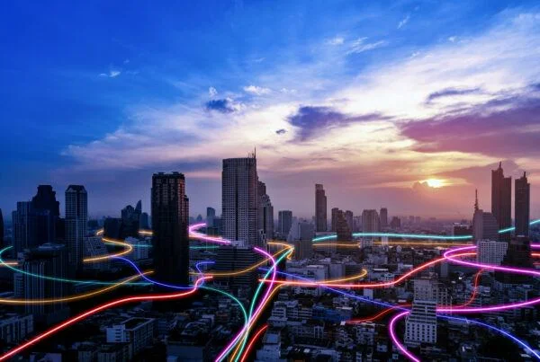 Modern city skyline with intersecting neon lines representing field service delivery powered by technology.