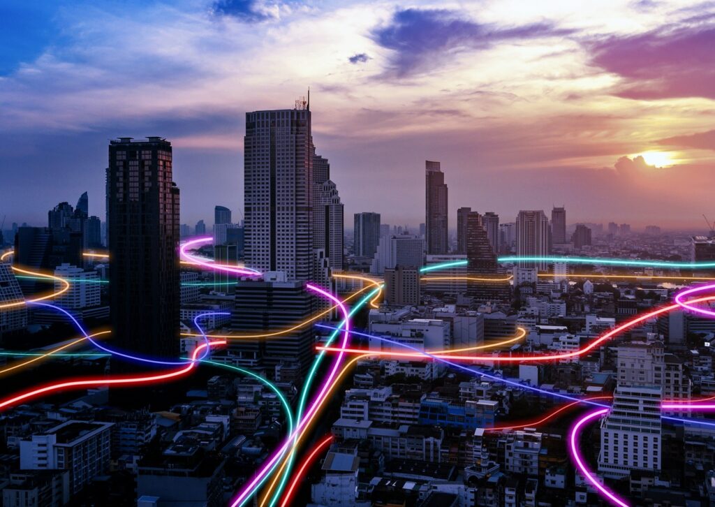 Modern city skyline with intersecting neon lines representing field service delivery powered by technology.