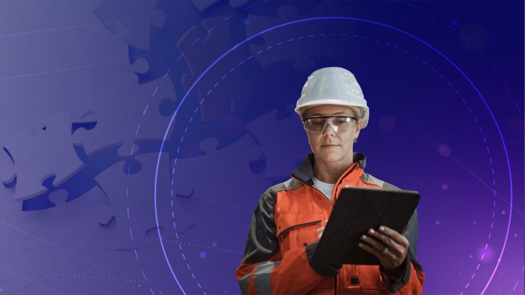 Field worker wearing a. helmet using a tablet