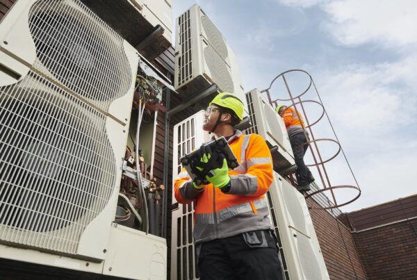 Field engineer holding a tablet and working outside